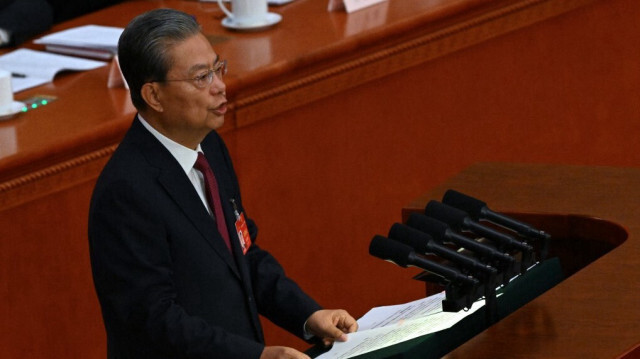 Le président du Comité permanent de l'Assemblée populaire nationale, Zhao Leji, présente son rapport lors de la deuxième session plénière de l'Assemblée populaire nationale à la Grande Salle du Peuple à Pékin, le 8 mars 2024.