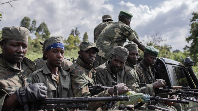 Des soldats du M23 quittent le camp de Rumangabo après la réunion entre les représentants de l'EACRF et les rebelles du M23 lors de la cérémonie de transfert au camp de Rumangabo, dans l'est de la République démocratique du Congo, le 6 janvier 2023.