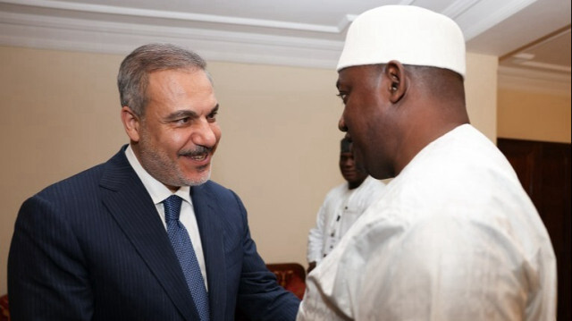 Turkish Foreign Minister Hakan Fidan (L) meets with President of Gambia Adama Barrow (R) within the 15th session of the Organization of Islamic Cooperation (OIC) in Banjul, Gambia on May 04, 2024.