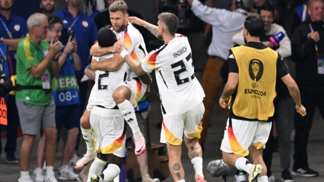 L'attaquant allemand n°09 Niclas Füllkrug célèbre le premier but de son équipe avec ses coéquipiers lors du match de football du groupe A de l'Euro 2024 entre la Suisse et l'Allemagne, à Francfort, le 23 juin 2024.