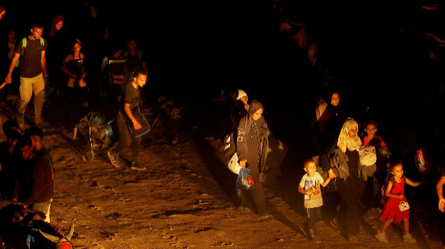 Палестинцы идут пешком из Хан-Юниса после того, как израильская армия приказала им покинуть свои районы, 1 июля 2024 года.