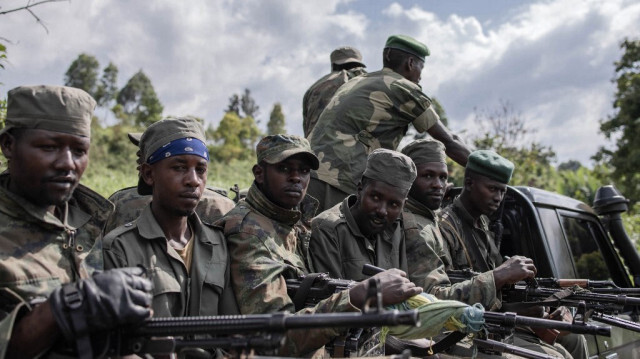 Les soldats du M23 quittent le camp de Rumangabo après la réunion entre les responsables de l'EACRF et les rebelles du M23 lors de la cérémonie de passation de pouvoir au camp de Rumangabo dans l'est de la République démocratique du Congo, le 6 janvier 2023. 