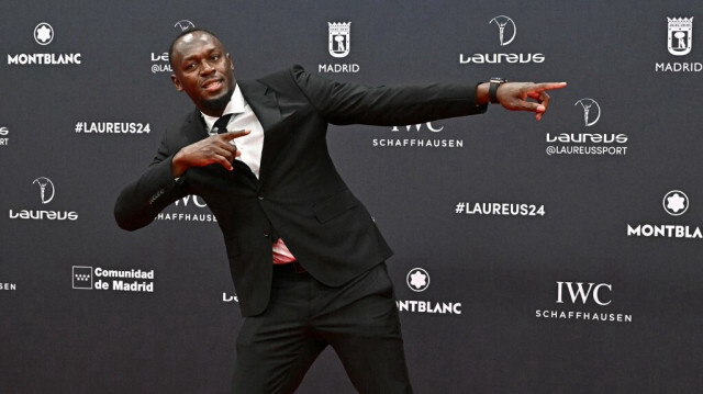 Le sprinteur jamaïcain Usain Bolt pose sur le tapis rouge avant la 25e cérémonie des Laureus World Sports Awards à Madrid le 22 avril 2024.