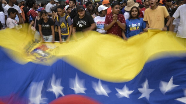 Des partisans du président vénézuélien, Nicolas Maduro participent à une marche de soutien aux résultats des élections présidentielles à Caracas, le 5 août 2024.