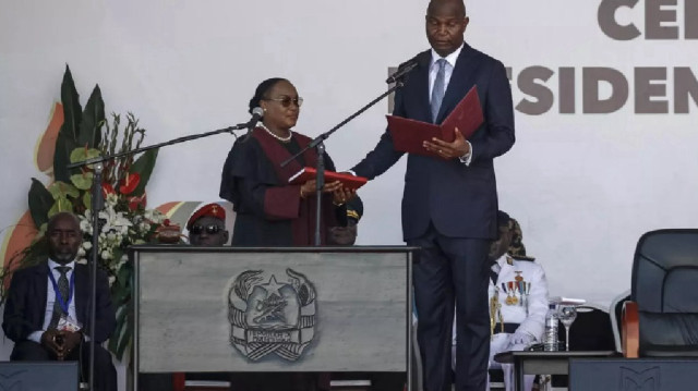 Daniel Chapo (R) was sworn as Mozambique's president. (Photo Credit: © Phill Magakoe / AFP)