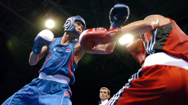 Somluck Kamsing (à gauche) aux Jeux olympiques d'Athènes, le 16 août 2004. 