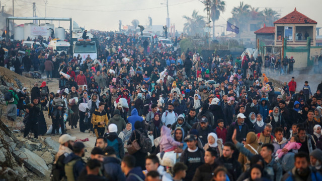 Palestinians, displaced by Israel forces, return their houses through Al-Rashid Street on the coastal strip following the ceasefire agreement in Gaza City, Gaza on January 27, 2025.