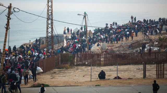 Palestinians, displaced by Israel forces, return their houses through Al-Rashid Street on the coastal strip following the ceasefire agreement in Gaza City, Gaza on January 27, 2025.