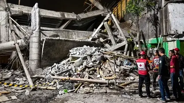 At least 91 students feared trapped after school building collapsed in Indonesia
