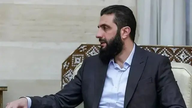 Syria's New Leader Vows to Pursue Assad Through Legal Channels