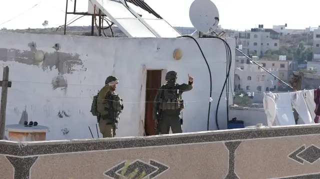 Israeli forces wound two Palestinians in West Bank raid