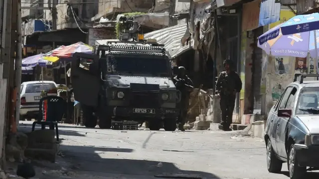 Israeli Forces Detain 19 Palestinians as Settlers Attack in West Bank