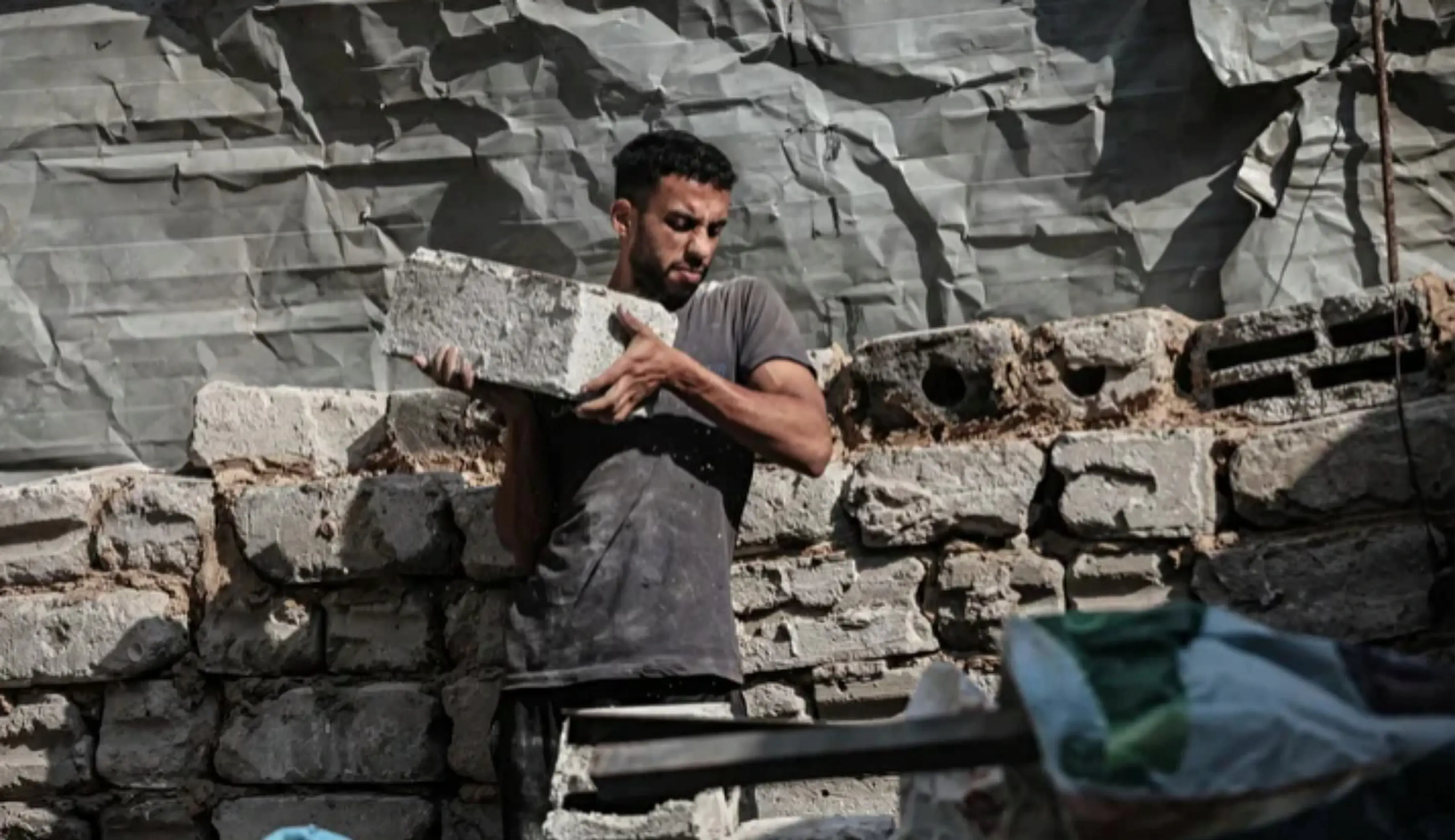 Palestinians rebuild homes using bricks salvaged from rubble in Gaza

