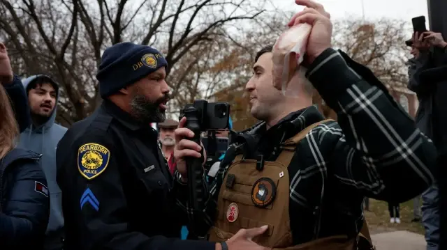 Republican Senate candidate attempts Quran burning at Michigan protest