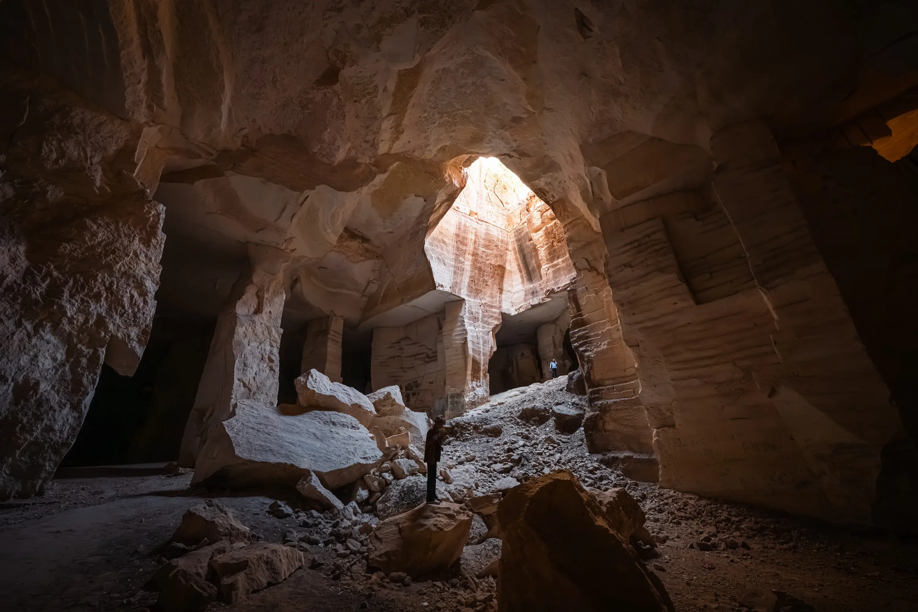 <p>An inside view of the nearly 2,000-year-old Bazda Caves on November 01, 2025, located within the historical Harran district of Turkiye's Sanliurfa, on UNESCO's Tentative World Heritage List, reveals an impressive landscape and mysterious past that attract visitors, while centuries of stone extraction for nearby historic sites such as the Harran Walls, the Shuayb Ancient City, and the Han el-Barur Caravanserai have created numerous courtyards, tunnels, and galleries throughout the caves.</p>