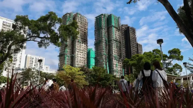 Hong Kong begins three-day mourning for 128 killed in massive fire