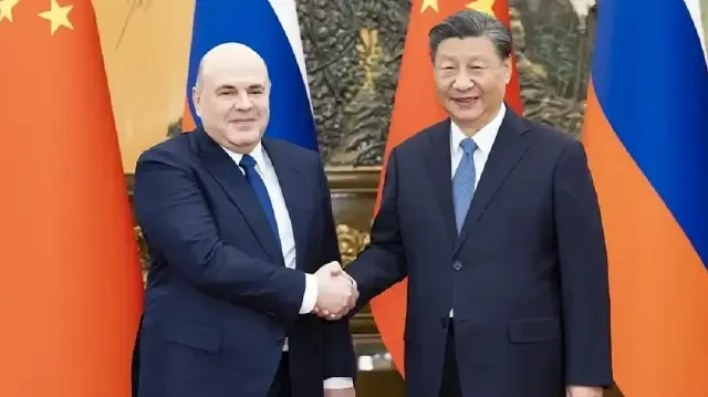 Xi and Mishustin discuss growing China-Russia trade ties in Beijing