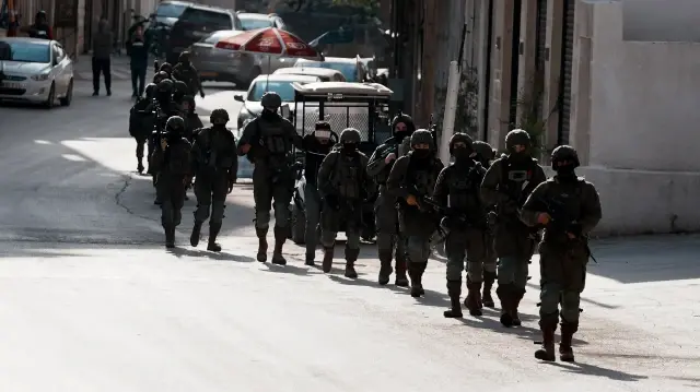 Israeli settlers assault Palestinians, torch car in West Bank attack