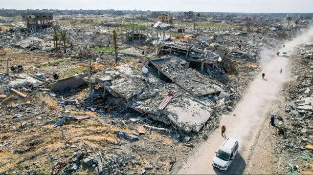 An aerial view shows the ruble of destroyed residential buildings, the streets and avenues after the Israeli bombardment left a huge destruction at Tel Al-Sultan area following withdrawal of Israeli army in Rafah, Gaza on January 19, 2025. [Ashraf Amra – Anadolu Agency]
