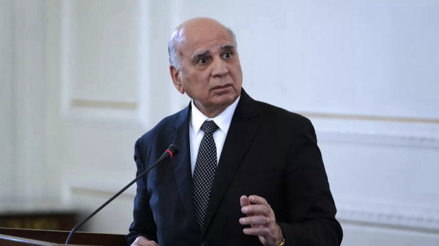 العراق يدعو إلى "تسوية سياسية شاملة تضمن وحدة سوريا"