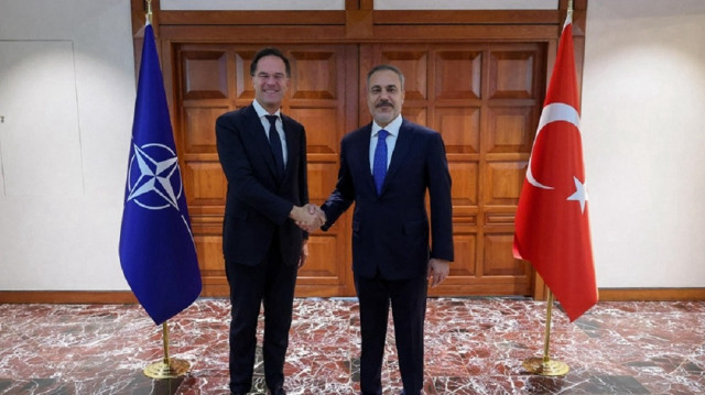 Türkiye's Foreign Minister Hakan Fidan (R) and NATO Secretary-General Mark Rutte (L)