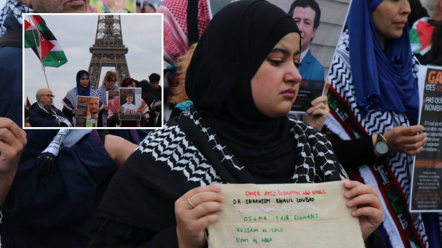 Eylemciler, ellerinde Filistin bayrakları ve üzerine Gazze'de öldürülen sivillerin isimlerinin nakışla işlendiği kumaşları taşıdı.