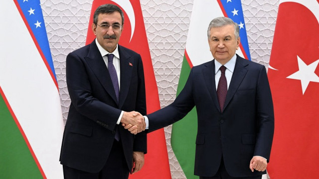 Turkish Vice President Cevdet Yilmaz (L) is welcomed by Uzbek President Shavkat Mirziyoyev (R) at the Presidential Palace during his official visit to Tashkent, Uzbekistan, on May 15, 2025.