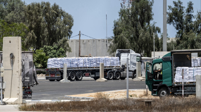 Trucks carrying aid enter Gaza through Kerem Shalom border crossing with Israel's permission on May 20, 2025. Israel has largely prevented the entry of humanitarian aid since 2 March, continues to be delivered in a limited way on the second day. (AA)