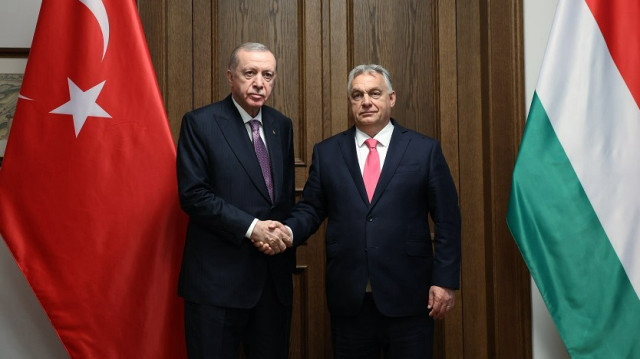 Turkish President Recep Tayyip Erdogan (L) receives Hungarian Prime Minister Victor Orban (R) as they attend the Organization of Turkic States (OST) Informal Summit in Budapest, the capital of Hungary on May 21, 2025.