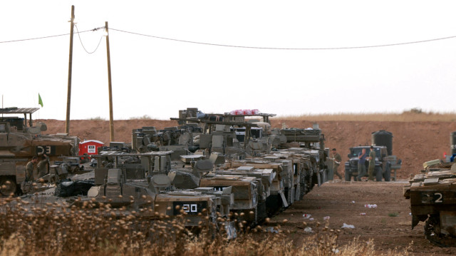 Des troupes israéliennes se déploient à la frontière entre Israël et la bande de Gaza, le 13 mai 2025, dans le cadre de la guerre entre Israël et le mouvement militant palestinien Hamas.
