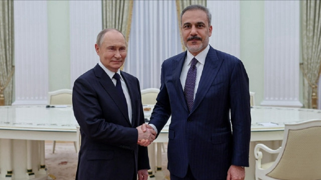 Turkish Foreign Minister Hakan Fidan (R) shakes hands with Russian President Vladimir Putin (L) as he is being received by Putin in Moscow, Russia on May 26, 2025.