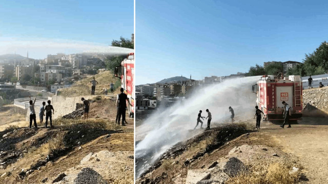 Çocukların itfaiyeden sıkılan suyun altında serinlemeye çalışması dikkat çekti.