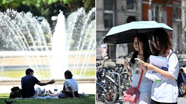 Brüksel'de vatandaşlar serin yerlerde vakit geçirmeyi ve sokakta şemsiye ile dolaşmayı tercih etti.