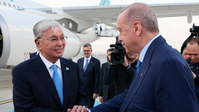 President of Kazakhstan Kassym-Jomart Tokayev (L) is welcomed by Turkish President Recep Tayyip Erdogan (R) upon his arrival at Esenboga Airport in Ankara, Türkiye, on July 28, 2025.