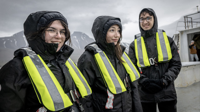5th National Arctic Scientific Research Expedition Coordinator Prof. Dr. Burcu Ozsoy (not seen) and students Rukiye Aslı Kilci (C), Elif Berra Demir (L), and Kaan Yusuf Odaci (R) are seen during the 5th National Arctic Scientific Research Expedition near Svalbard and Jan Mayen on July 10, 2025. During the 5th National Arctic Scientific Research Expedition, conducted under the auspices of the Turkish Presidency, the responsibility of the Turkish Industry and Technology Ministry, and the coordination of the TUBITAK MAM Polar Research Institute, scientists sought answers to questions about the future of the planet with 19 different marine projects in the Arctic region. (AA)