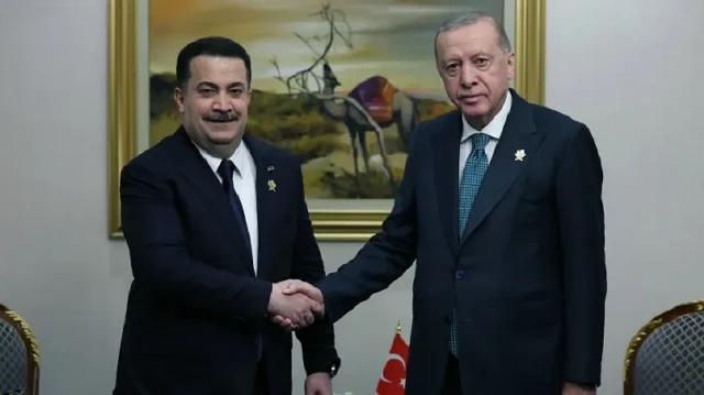 Turkish President Recep Tayyip Erdogan (R) meets with Iraqi Prime Minister Mohammed Shia' al-Sudani (L) as part of the Organization of Islamic Cooperation-Arab League Joint Extraordinary Summit on September 15, 2025 in Doha, Qatar.