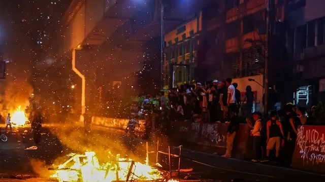 One dead, 216 arrested in mass rallies against corruption in Philippines