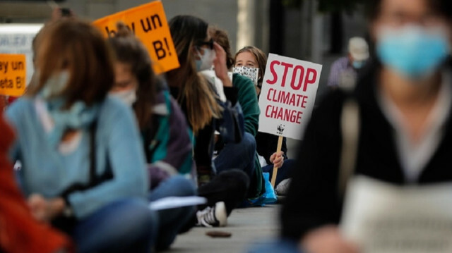 FILE PHOTO - The youth movement "Fridays for Future" stage a sit-in protest outside the parliament building to draw attention to climate change as the 75th UN General Assembly meetings are held, in Madrid, Spain. Photo: Burak Akbulut - Anadolu Agency
