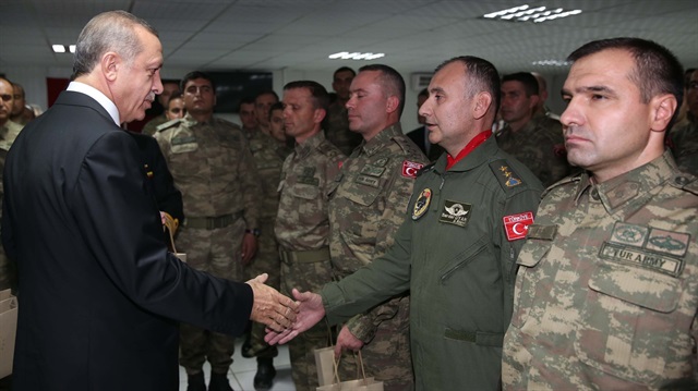 Turkish President Recep Tayyip Erdogan meets with Turkish soldiers during his visit to Turkish troops stationed in Afghanistan in Dogan Camp, Kabil, Afganistan on 18 October, 2014. 