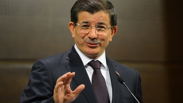 ANKARA, TURKEY - NOVEMBER 24: Turkish Prime Minister Ahmet Davutoglu speaks to media after he meets with 81 teachers coming from Turkey's 81 different cities during the Teachers Day at new Prime Ministry building in Ankara, Turkey, on November 24, 2014. (Halil Sağırkaya - Anadolu Agency)