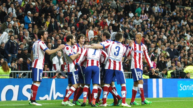 MADRID, SPAIN - JANUARY 15: Players of Atletico Madrid celebrate the score Spanish Copa del Rey (King's Cup) soccer match between Real Madrid and Atletico Madrid at Estadio Santiago Bernabeu on January 15, 2015 in Madrid, Spain. 