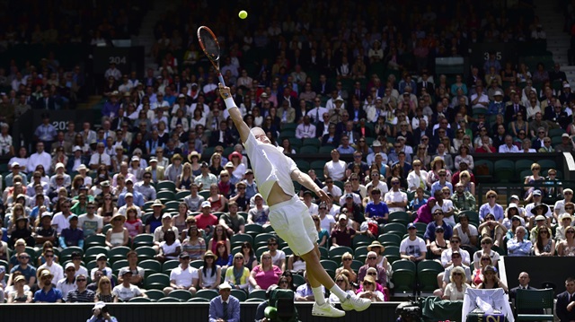 


Luke Saville of Australia reaches to hit a return to Grigor Dimitrov of Bulgaria during their men's singles tennis match at the Wimbledon Tennis Championships, in London in this June 25, 2014 file photo.             REUTERS/Toby Melville (BRITAIN - Tags: SPORT TENNIS TPX IMAGES OF THE DAY)