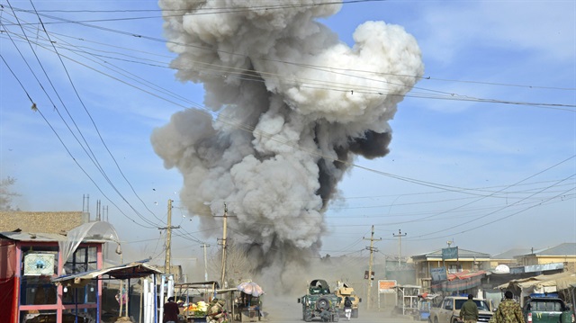 Smoke rises in the sky after a suicide car bomb attack in Kunduz province February 10, 2015. Taliban insurgents launched an attack on a police headquarters in northern Afghanistan, provincial police spokesman Sayed Sarwar Hosseini said. At least two policemen were wounded in the attack, and five suicide attackers were killed by Afghan forces, Hosseini reported.  REUTERS/Stringer (AFGHANISTAN - Tags: CIVIL UNREST TPX IMAGES OF THE DAY)