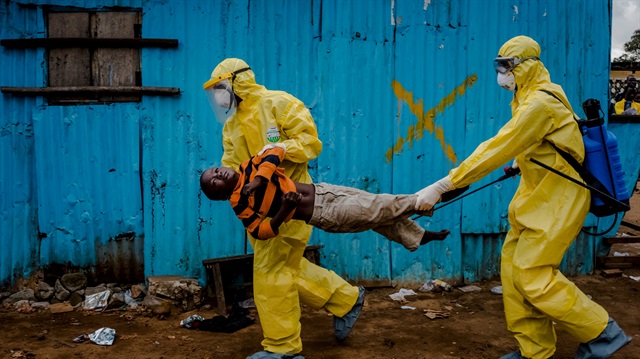 Medical staff carry James Dorbor, 8, suspected of having Ebola, into a treatment facility in Monrovia, Liberia, September 5, 2014.  Daniel Berehulak was awarded the Pulitzer Prize for feature photography on April 20, 2015, for his coverage of the Ebola outbreak in West Africa for The New York Times. Picture taken September 5, 2014. REUTERS/Daniel Berehulak/The New York Times/Handout via Reuters ATTENTION EDITORS - NO SALES. NO ARCHIVES. FOR EDITORIAL USE ONLY. NOT FOR SALE FOR MARKETING OR ADVERTISING CAMPAIGNS. THIS IMAGE HAS BEEN SUPPLIED BY A THIRD PARTY. IT IS DISTRIBUTED, EXACTLY AS RECEIVED BY REUTERS, AS A SERVICE TO CLIENTS. NO COMMERCIAL USE.	
      TPX IMAGES OF THE DAY