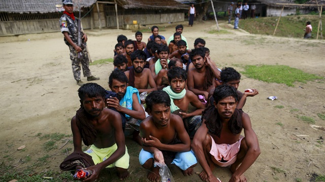 Refugees from Bangladesh who were rescued by the Myanmar navy, are pictured after taking a shower at a Muslim religious school used as temporary refugee camps, at Aletankyaw village in the Maungdaw township, in Rakhine state May 23, 2015. The head of the Myanmar state from which thousands of Rohingya Muslims are fleeing denied that persecution had prompted the exodus after the United States called on the country to deal with its root causes. Myanmar's navy discovered two Thai trafficking boats off the coast of Rakhine on Thursday, one carrying migrants and the other empty, the state government said in a statement on Friday. REUTERS/Soe Zeya Tun