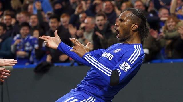 Chelsea's Didier Drogba celebrates after scoring a goal against Tottenham Hotspur during their English Premier League soccer match at Stamford Bridge in London December 3, 2014. REUTERS/Eddie Keogh   (BRITAIN - Tags: SPORT SOCCER) NO USE WITH UNAUTHORIZED AUDIO, VIDEO, DATA, FIXTURE LISTS, CLUB/LEAGUE LOGOS OR "LIVE" SERVICES. ONLINE IN-MATCH USE LIMITED TO 45 IMAGES, NO VIDEO EMULATION. NO USE IN BETTING, GAMES OR SINGLE CLUB/LEAGUE/PLAYER PUBLICATIONS. FOR EDITORIAL USE ONLY. NOT FOR SALE FOR MARKETING OR ADVERTISING CAMPAIGNS