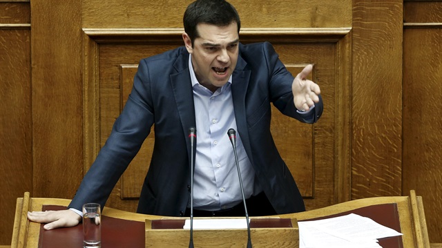 Greek Prime Minister Alexis Tsipras addresses lawmakers during a parliamentary session in Athens May 8, 2015. Tsipras expressed optimism on Friday that Athens would soon reach a deal with its foreign lenders that will unlock further aid under its EU/IMF bailout. REUTERS/Alkis Konstantinidis