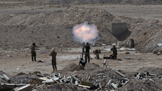 REFILE - CORRECTING GRAMMAR

Members of the Iraqi army and Shi'ite fighters launch a mortar toward Islamic State militants on the outskirts of the city of Falluja, Iraq May 19, 2015. Iraqi security forces on Tuesday deployed tanks and artillery around Ramadi to confront Islamic State fighters who have captured the city in a major defeat for the Baghdad government and its Western backers.  REUTERS/Stringer