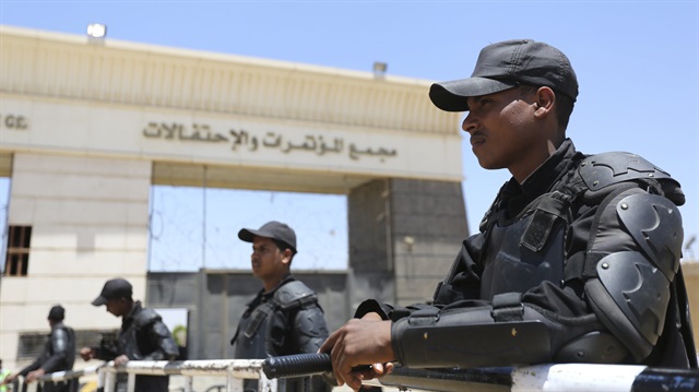Policemen take their positions during the trial of ousted Egyptian President Mohamed Mursi and Muslim brotherhood leaders at a court in the outskirts of Cairo, Egypt May 16, 2015. An Egyptian court on Saturday sought the death penalty for former president Mohamed Mursi and more than 100 other members of the Muslim Brotherhood in connection with a mass jail break in 2011. REUTERS/Mohamed Abd El Ghany
