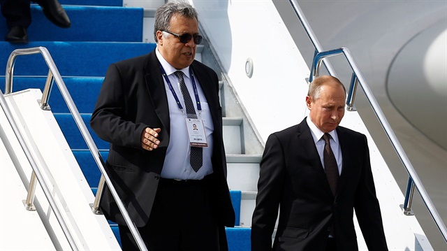 Russian Ambassador to Turkey Andrei Karlov accompanies Russian President Putin who disembarks from the Presidential aircraft at Ataturk airport in Istanbul
